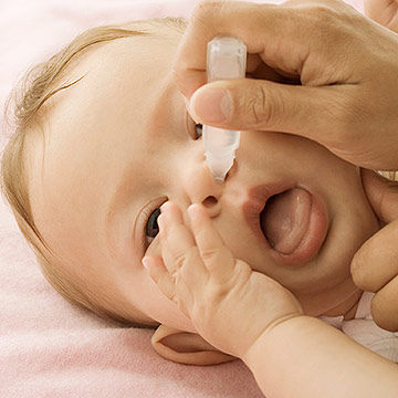 giving baby saline nose drops